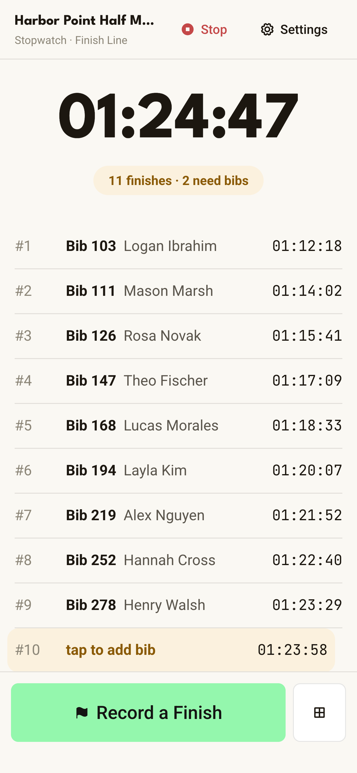 The Run This Stopwatch on a phone at the finish line, with the race clock running and a list of finishers by bib and time
